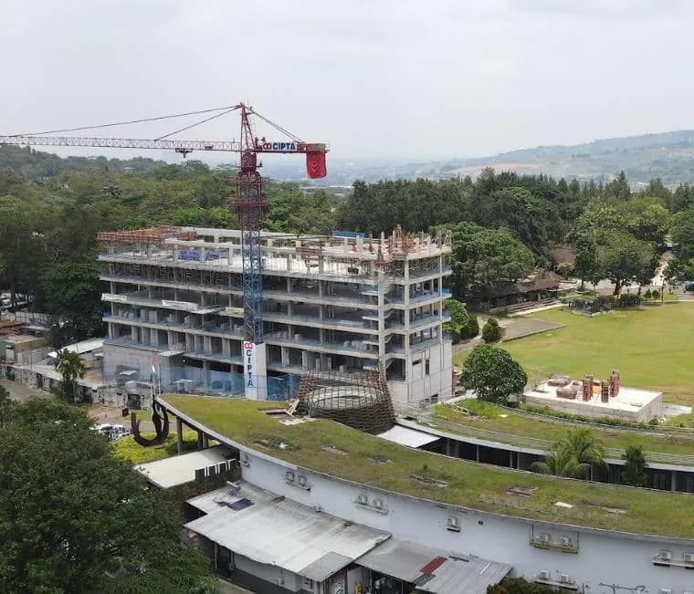 Hotel expansion under construction, tower crane on site