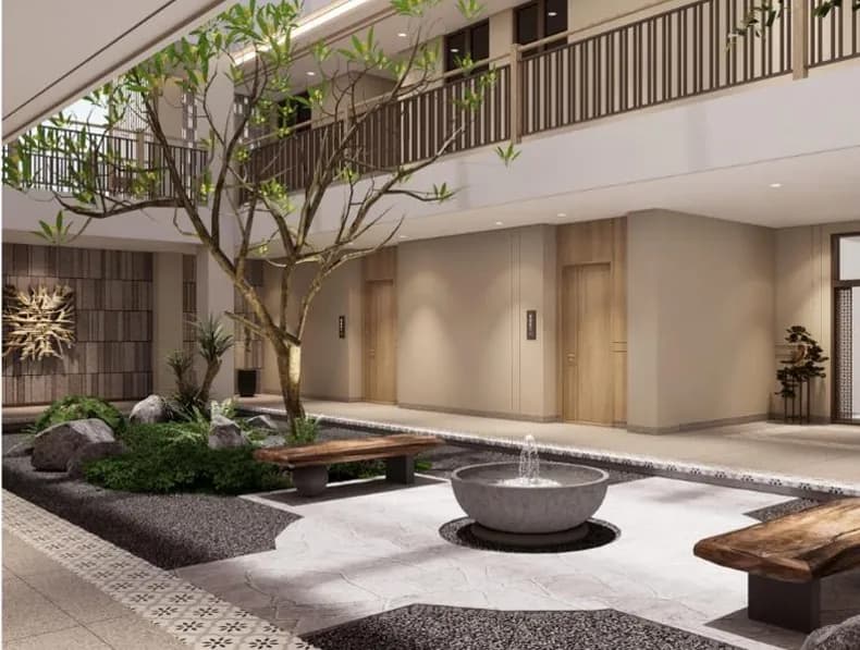 Guest house complex courtyard with mature tree