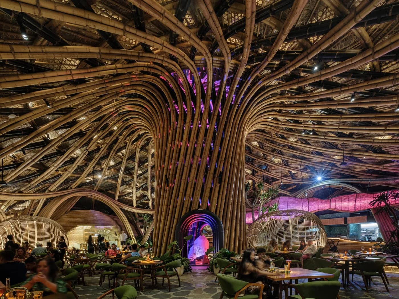 Luna Beach Club: the completed bamboo canopy seen from below, arched ribs fanning across the ceiling