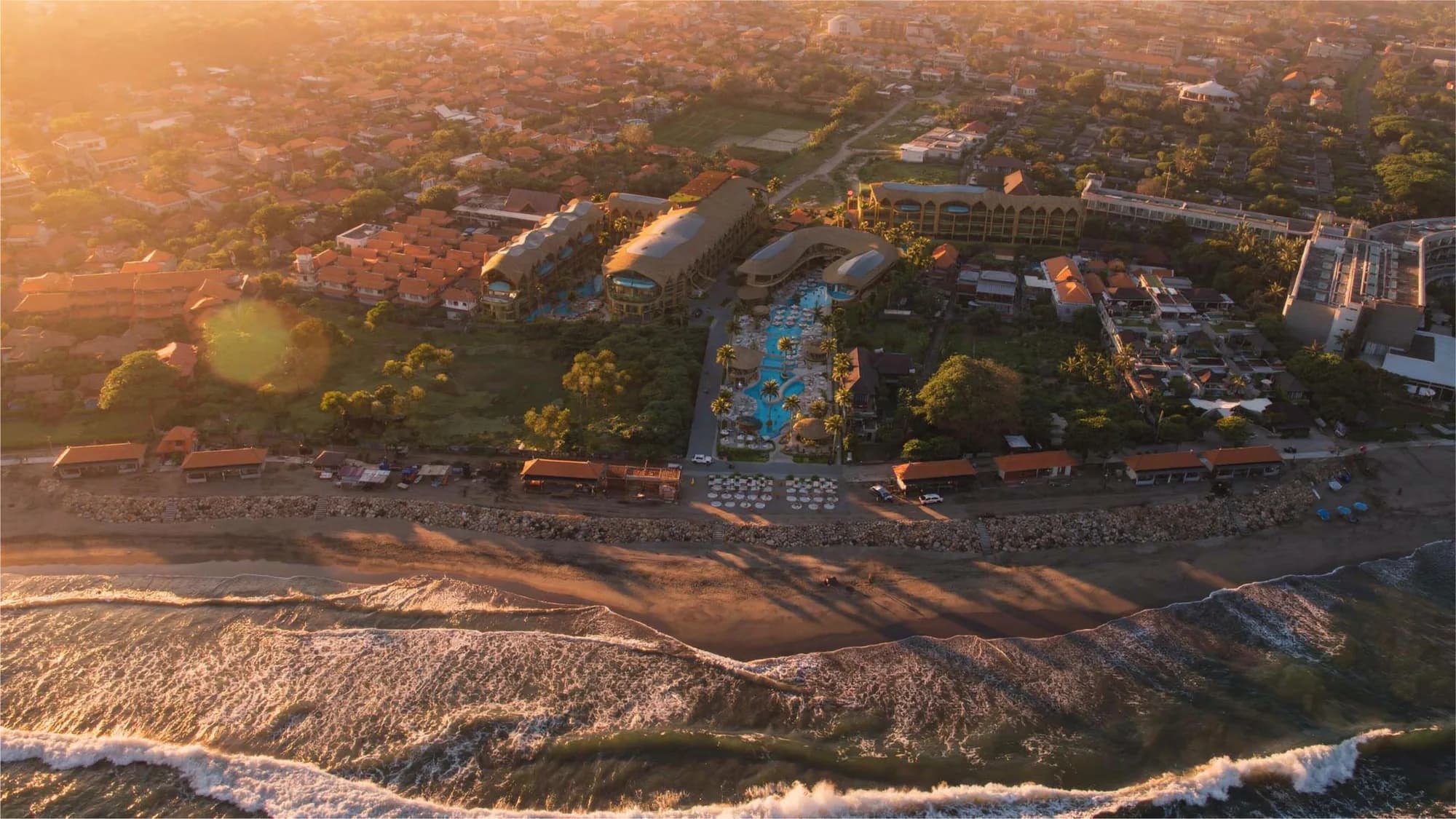 The widest aerial, the whole site read from over the surf at sunset