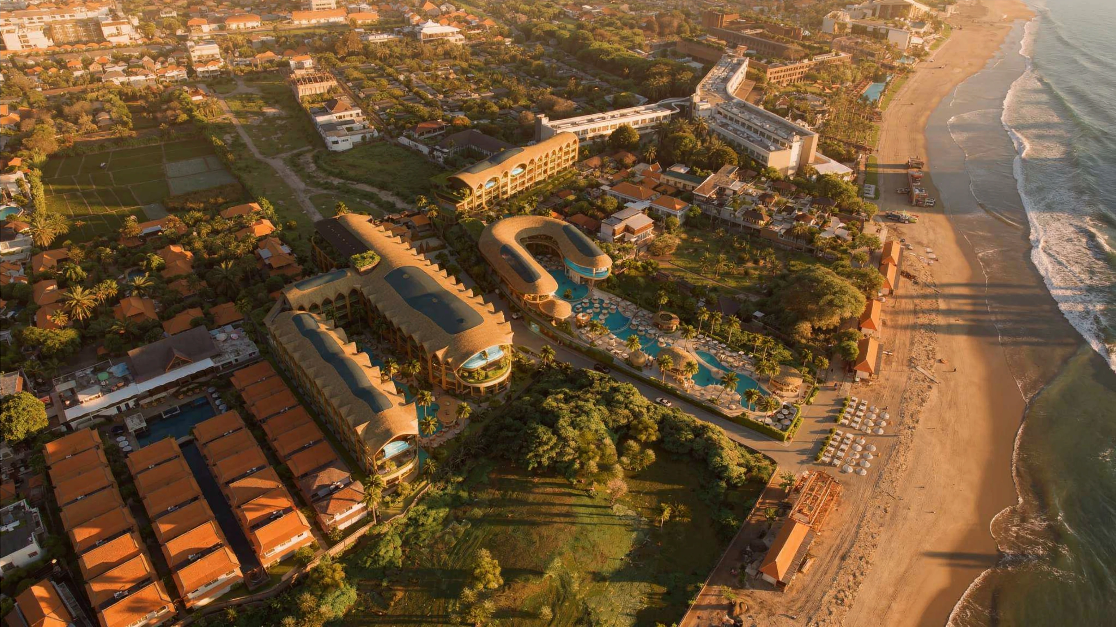 Aerial view of the Seminyak coastline with ELLE Resort and Beach Club Bali in place